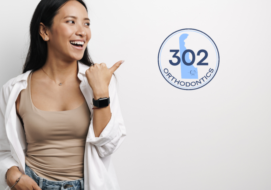 girl pointing to 302 logo